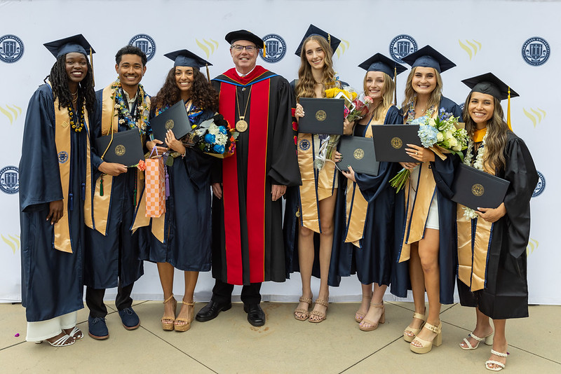 Group of vanguard students with president Michael Beals