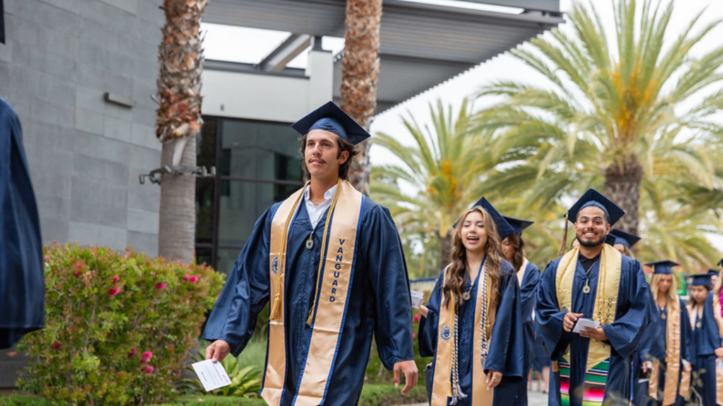 Vanguard graduates walking at commencement
