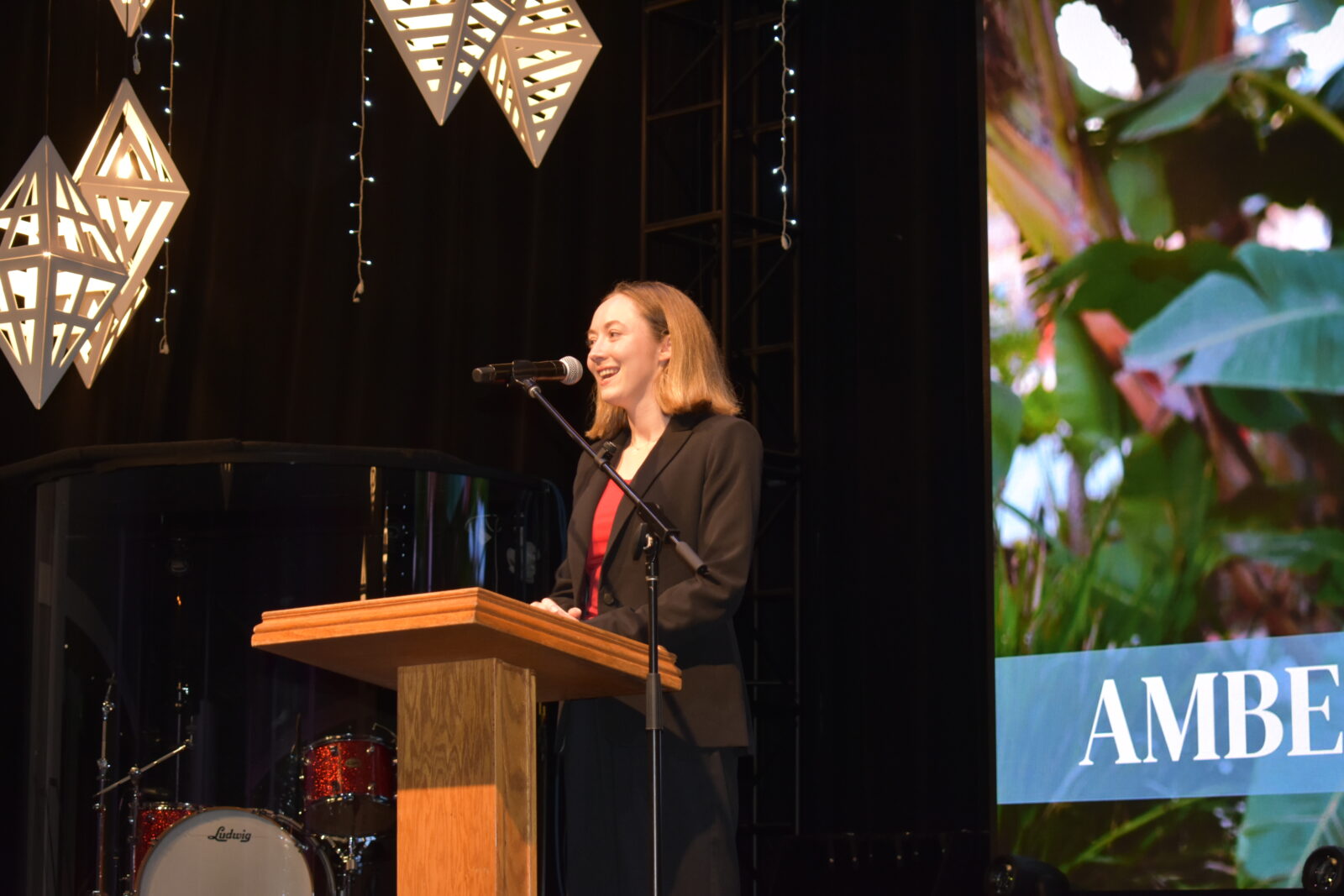 Student speaking on stage at Vanguard University