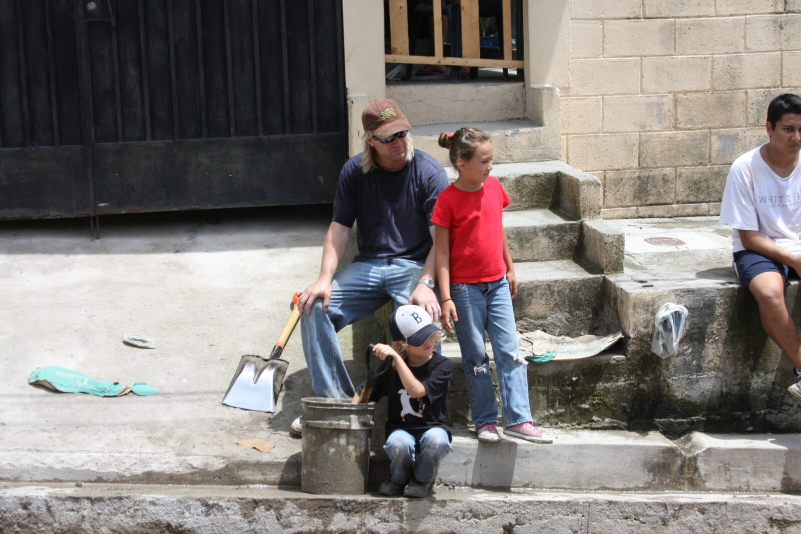 a father and kids sitting
