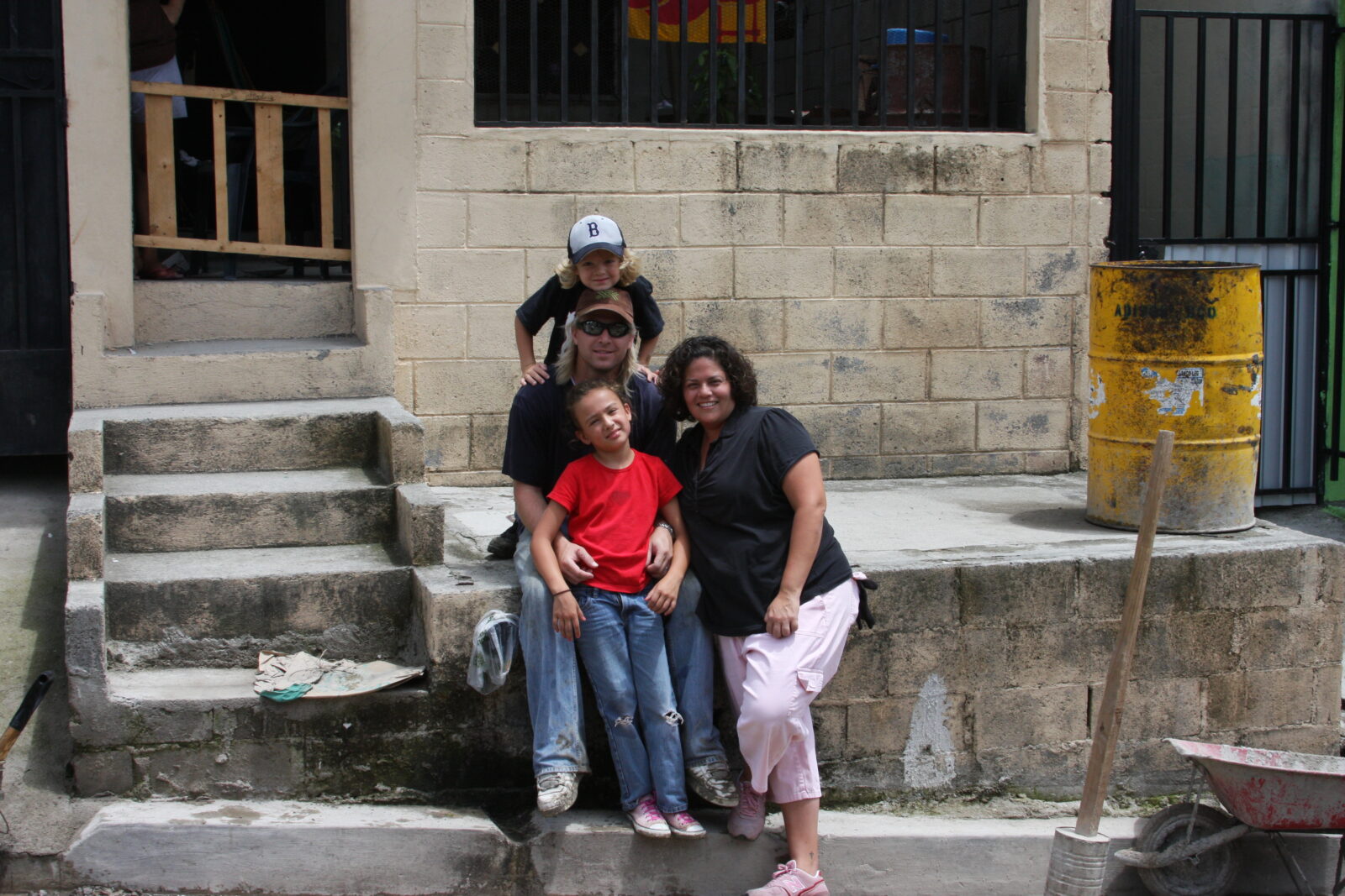 a family sitting and smiling